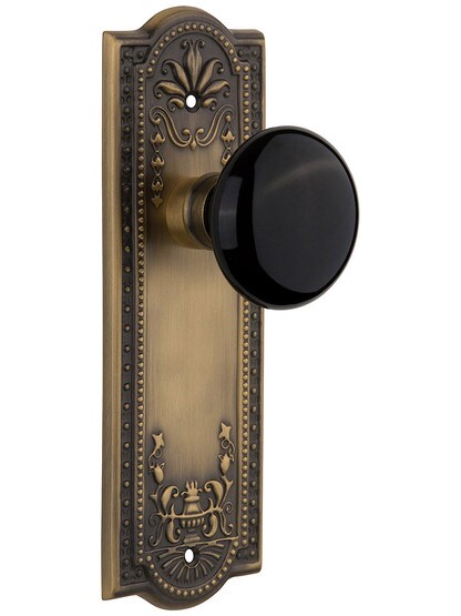 Meadows Plate with Black Porcelain Knob without Keyhole in Antique Brass with .
